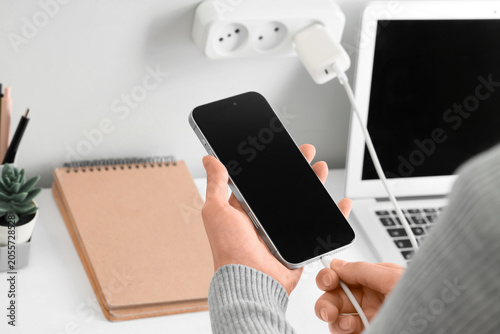 Person connecting smartphon...