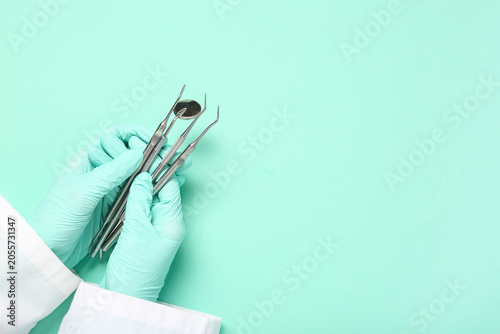 Dentist hands in protective...