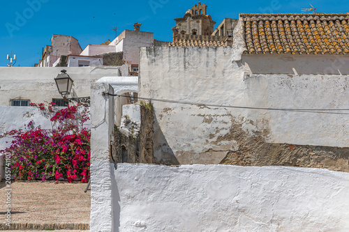 Archway and bougainvillea in old town of Arcos de la Frontera, Spain