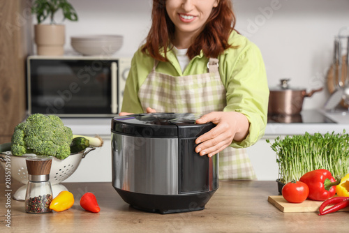 Woman in apron preparing he...