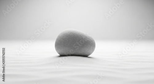 Close up of round stone on white surface.