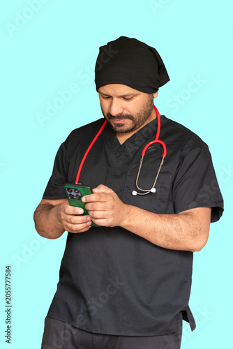Modern medical doctor or nurse checking patient data on cellphone, portrait with copy space