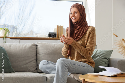 Smiling muslim woman in hij...