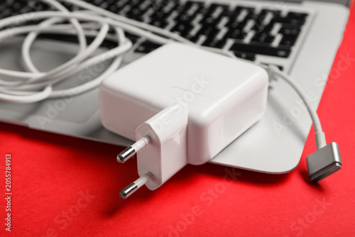 White laptop charger and po...