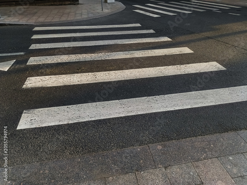 Empty pedestrian crossing on the city street with nobody, no people