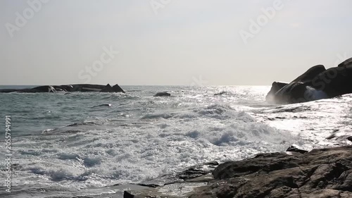 Huge waves crashing against the rocks。Stone Park Scenic Area, Hainan, China