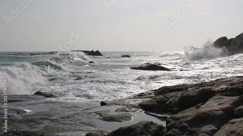 Huge waves crashing against the rocks。Stone Park Scenic Area, Hainan, China