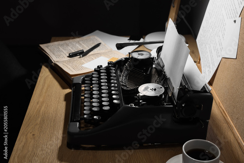 Vintage typewriter with pap...