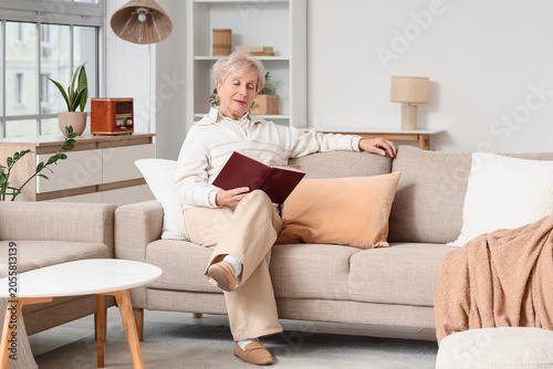 Beautiful senior woman read...