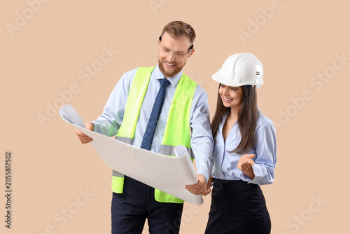 Young engineers with house ...