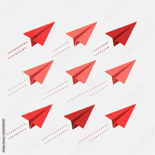 Red paper airplanes flying in formation