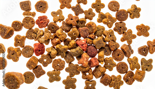 Assorted Dry Pet Food Pellets: A vibrant, scattered assortment of dry pet food pellets, in various shapes and colors, fills the frame, offering a close-up view of textured kibble.
