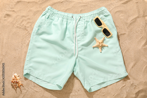 Mint green swim trunks with...