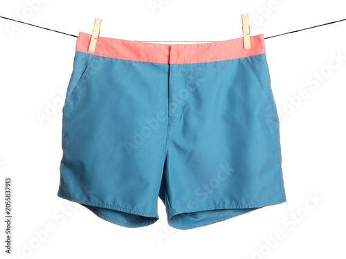 Εκτύπωση καμβά Blue swim trunks with coral waistband drying on clothesline, summer vacation and