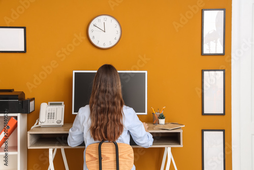 Businesswoman working at de...