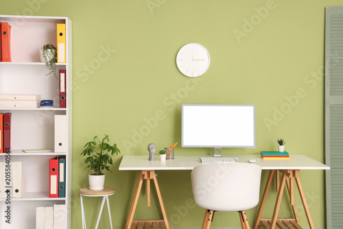 Modern workplace with wall ...