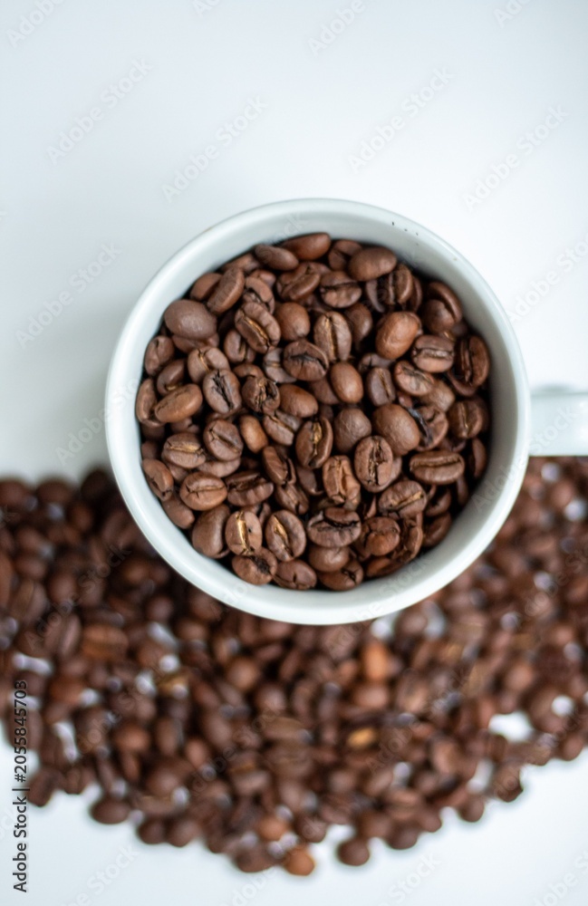 Naklejka premium coffee beans in a cup