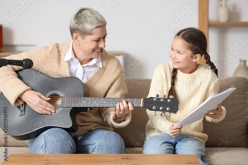 Female music teacher giving...