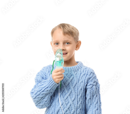 Cute little boy using nebul...