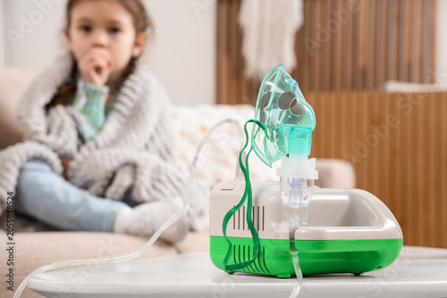 Nebulizer on table against ...