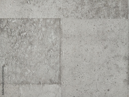 Textured stone pattern backdrop with contrasting metallic gray tiles