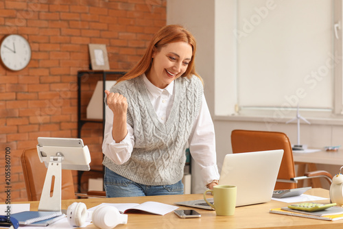 Excited woman celebrating b...