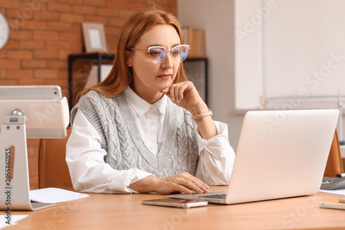 Focused mature businesswoma...