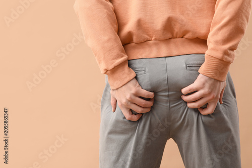 Φωτογραφία Man with itchy buttocks health problem and discomfort skin irritation and hygien