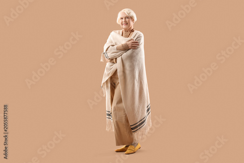 Senior woman with shawl on ...