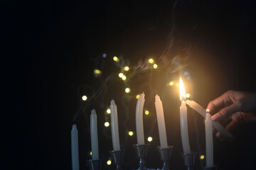Hanukkah candles glowing brightly during the Jewish Festival of Lights celebration. 