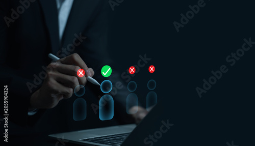 Businessman selecting digital candidate profile icons representing people management, recruitment strategy, and HR digital business. modern human resources solutions, employee relationship