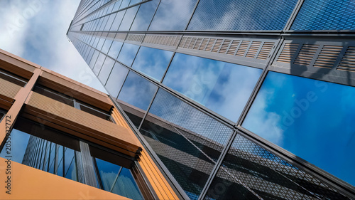 Modern glass facade of a tall skyscraper building