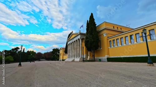 Zappeion hall with people at historical square street road in summer ancient city by National Gardens of Athens, Greece