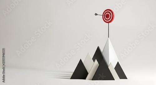 Arrow hits bullseye on target atop abstract mountain