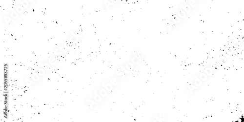 Fotografie Dust motes or specks floating in the air, creating a grainy, textured effect against a bright white background
