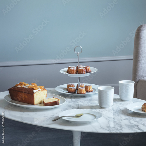 Afternoon tea table with cake and mini pastries