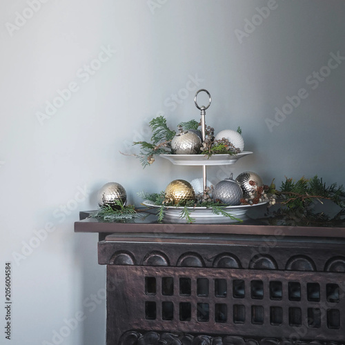 Christmas ornaments displayed on tiered serving stand