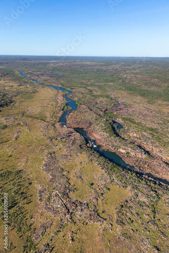 Aerial view of 3 cascading waterfalls on the western arm of the Mitchell River and looking east along the Mitchell Plateau.