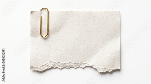 Torn paper note with gold paperclip on white background