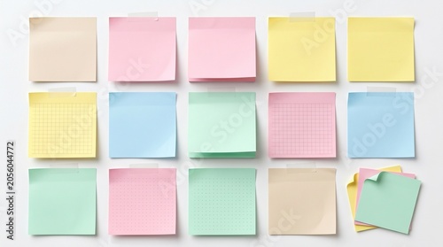 Colorful sticky notes arranged neatly on a plain surface in office