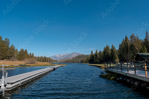Twin Boat Docks on Hume Lake with Snowy Sierra Nevada Mountain Backdrop California
