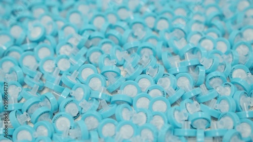 Macro laboratory footage of PTFE syringe filters used for sample preparation before liquid chromatography and HPLC analysis. Analytical chemistry lab process, filtration of samples, research