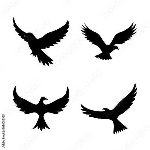Bild auf Leinwand Four black birds flying in different directions - Minimalist vector illustration of four black birds in flight, each facing a distinct direction for dynamic composition
