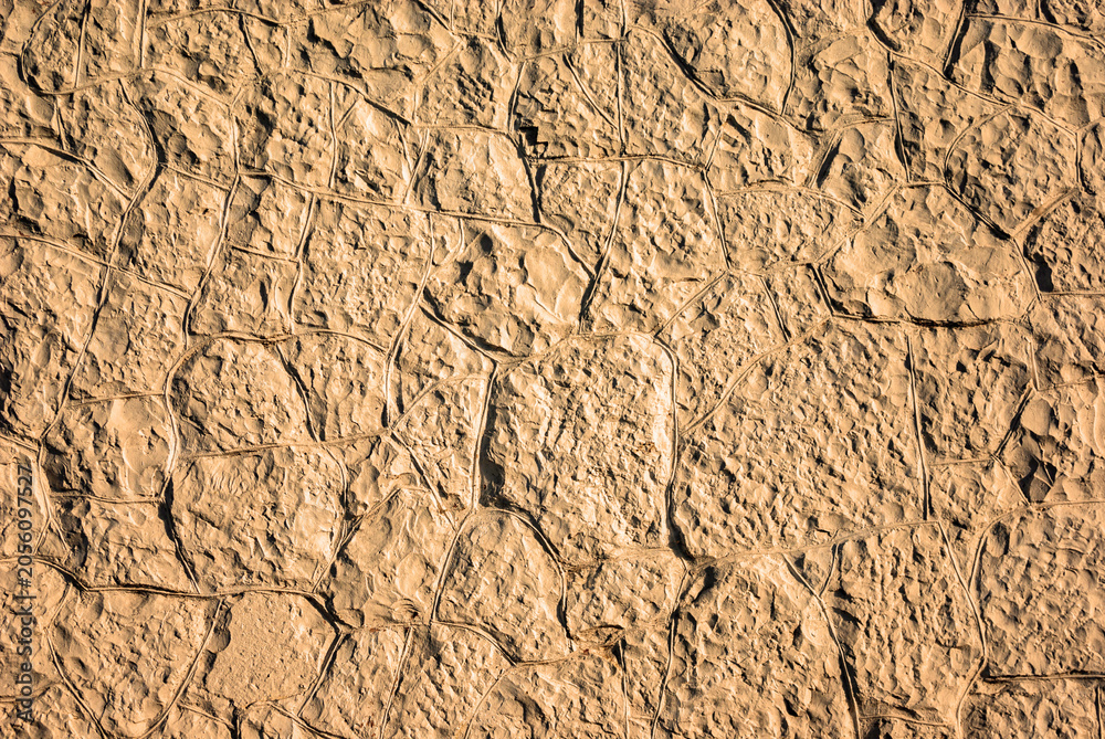 Naklejka premium Brown stoned wall as a texture, pattern, background