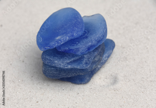 Stacked Cobalt Sea Glass on Sandy Beach with Natural Light