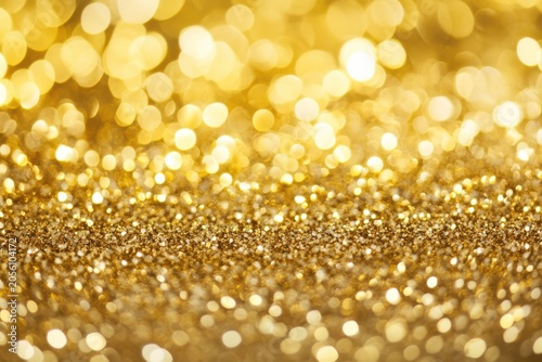 Golden Bokeh Lights and Glitter Particles on Warm Blurred Background Texture sparkle
