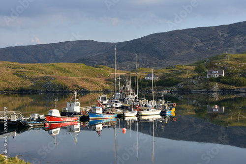 Scenic Outer Hebrides Seascape with Docked Fishing Vessels