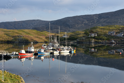 Highland Inlet with Colorful Boats Reflecting in Calm Waters