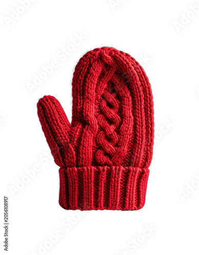 A single red knitted mitten with a cable knit pattern stands out against a stark black background.