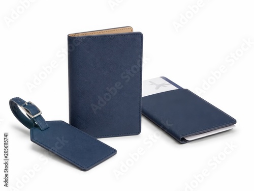 Minimal travel passport holder with luggage tag and boarding pass sleeve for portable travel organization on white background